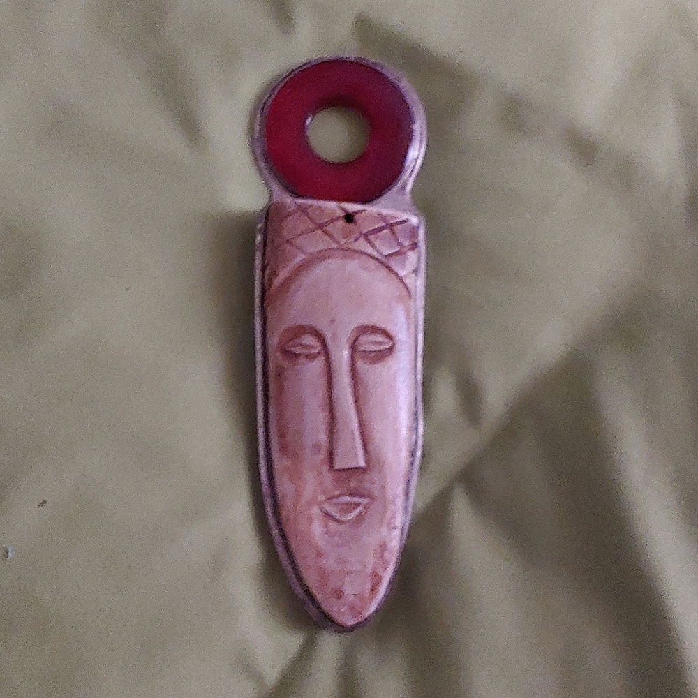 Carnelian and carved bone pendant